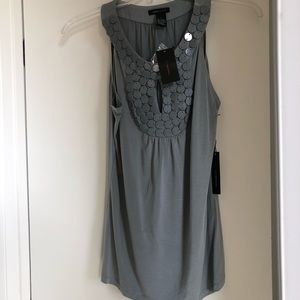 BCBG sleeveless top with keyhole design.